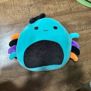 Squishmallow Teal Plush Toy with Black and Orange Accents